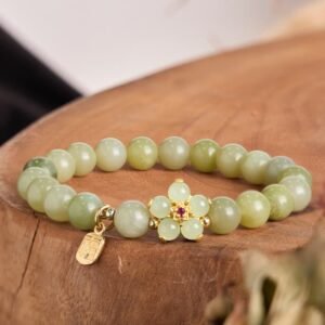 Quiet Wisdom, Worn Daily. Green Jade Flower Fu Character Charm Bracelet by AetherFate