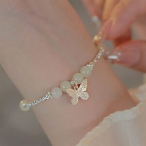 Gentle Focus, Worn Daily. Sterling Silver Hetian Jade Butterfly Charm Bracelet by AetherFate