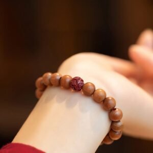 Quiet Grounding, Worn Daily. Peach Wood Lotus Cinnabar Bracelet by AetherFate