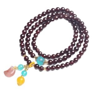 Against the Wrist | Original Three-Circle Garnet Bracelet by AetherFate